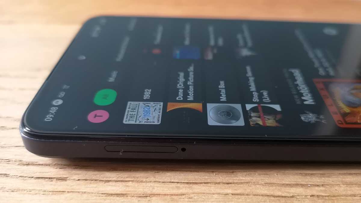 A close up of the Motorola Moto G84 5G's SIM and microSD card tray on the phone's upper left-hand side