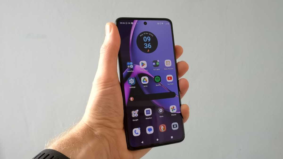 A wide shot of the Motorola Moto G84 5G viewed from the front, with the home screen